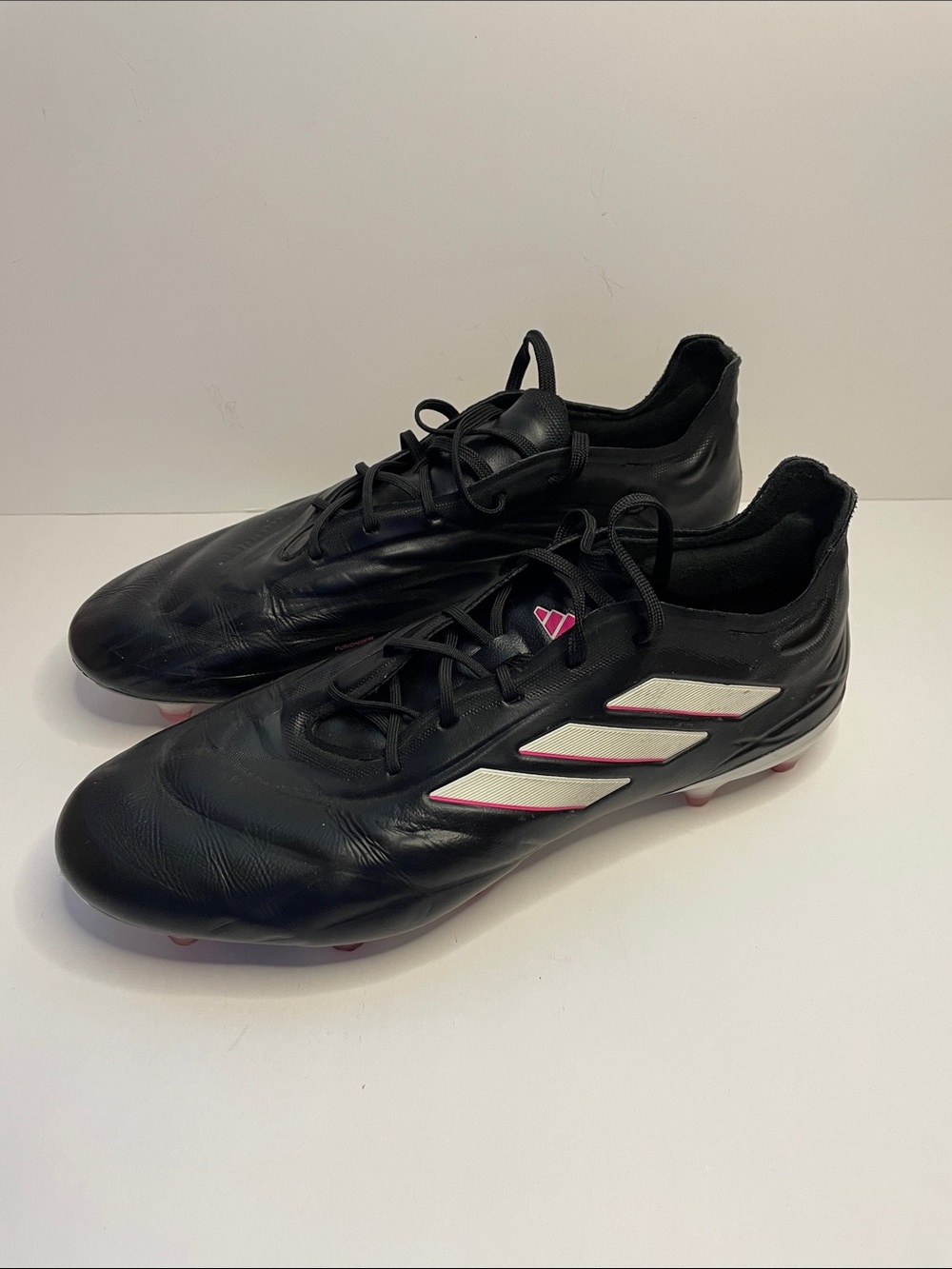 adidas Men’s Black Soccer Cleats with White Stripes and Pink Accents.  Size 11.